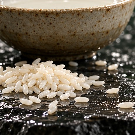 A bowl of rice water and rice grains
